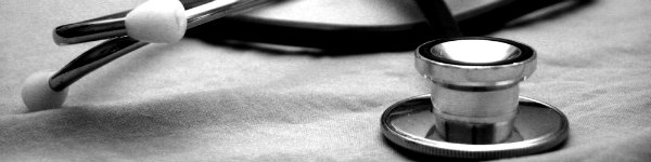 A gray and white photo of a stethoscope.