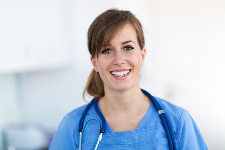 smiling female nurse scrubs