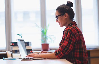 Young woman working at laptop