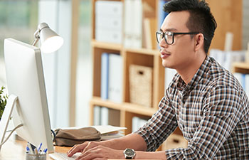man working on computer in modern office