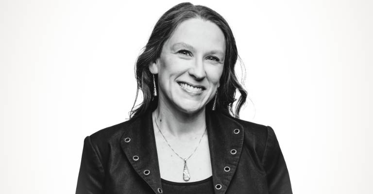 Woman smiling at the camera on a white background