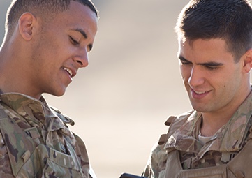 two military students talking