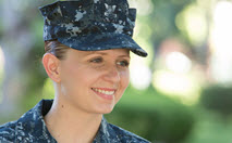 women in fatigues smiling