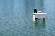 A desk surrounded by water