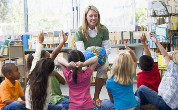 teacher reading to young children