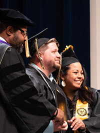 James Scott and Tracy Ly Scott at a Purdue Global graduation ceremony