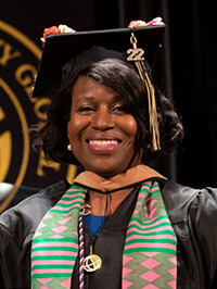 Sheila Taylor in cap and gown at a Purdue Global graduation ceremony